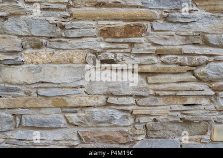 Vieux fond détaillées haut mur de brique en pierre mince. Banque D'Images