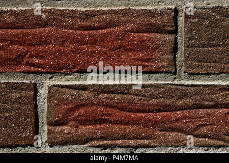 Mur d'une maison de brique rouge-gris dans la couleur, la texture, l'arrière-plan Banque D'Images