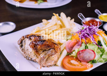 Cuisine péruvienne: Pollo a la brasa Banque D'Images