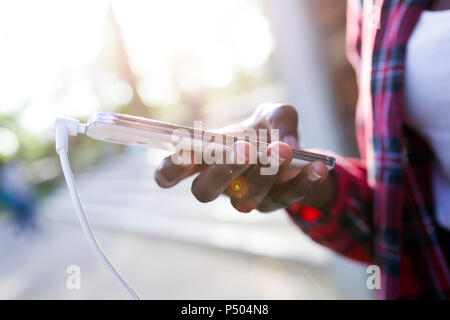 Woman's hand holding smartphone, close-up Banque D'Images