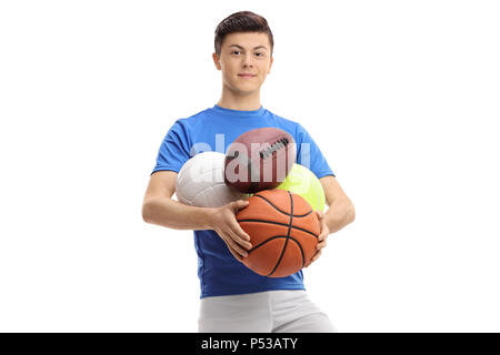 Teenage boy avec ballons de sport isolé sur fond blanc Banque D'Images