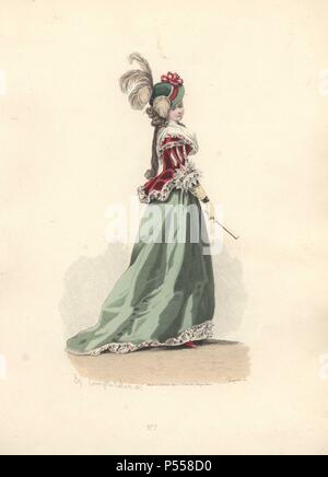 Femme en vert bonnet de plumes, veste de velours cramoisi sur une longue jupe en soie verte complète avec bordure à motifs floraux.. . Francois-Claudius Compte-Calix (1813-1880) est un peintre et illustrateur. Un exposant régulièrement aux salons, il a illustré de nombreux ouvrages et de plusieurs livres de poésie romantique, et contribue depuis des années à la mode magazine 'Modes parisiennes'.. . Lithographie coloriée d'une illustration par Francois-Claudius Compte-Calix de 'Les Modes Parisiennes sous le Directoire" (Paris Fashions sous le répertoire 1795-1799) 1865. Banque D'Images