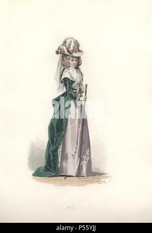 Mode femme en bonnet fleuri, portant un manteau de velours vert sur une robe en soie gris et tenant une canne.. . Francois-Claudius Compte-Calix (1813-1880) est un peintre et illustrateur. Un exposant régulièrement aux salons, il a illustré de nombreux ouvrages et de plusieurs livres de poésie romantique, et contribue depuis des années à la mode magazine 'Modes parisiennes'.. . Lithographie coloriée d'une illustration par Francois-Claudius Compte-Calix de 'Les Modes Parisiennes sous le Directoire" (Paris Fashions sous le répertoire 1795-1799) 1865. Banque D'Images