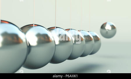 Newton's Cradle isolé sur fond gris Banque D'Images