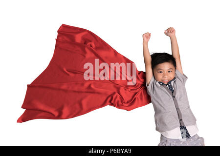 Super-héros volant en studio, les enfants font semblant d'être super-héros, super hero kid, de succès, de créativité et d'imagination,concept chemin de détourage. Banque D'Images