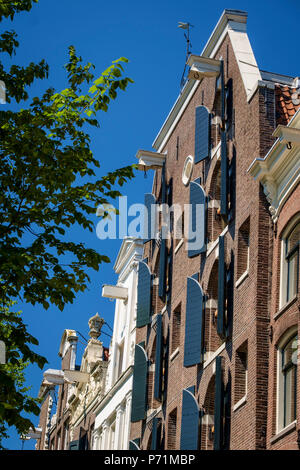 Façades des entrepôts du 18ème siècle converti en propriétés résidentielles, Amsterdam, Pays-Bas Banque D'Images