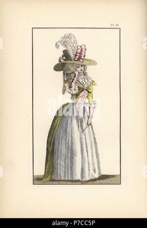 Femme en taffetas jaune canari demi-redingote, corsage blanc, rose a fait le jupon de taffetas, et fichu. Son chapeau de paille est décoré avec des rubans et des panaches. Lithographie coloriée de modes et coutumes de Marie Antoinette et son temps, par le Comte de Reiset, Paris, 1885. Le journal de Madame Eloffe, couturière et de lin-marchand à la Reine et des dames de la cour. Banque D'Images