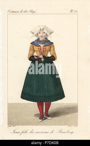 Jeune fille de la région de Bamberg, en Franconie, Allemagne, 19e siècle. Dans ses habits du dimanche en allant à l'église, tenant un livre de prières, avec sa gorge couverte par un foulard, et les cheveux couverts par un fichu plié, plissé jupons et bas rouge. La gravure sur cuivre coloriée par Georges Jacques Gatine après une illustration par Louis Marie lante de costumes de divers pays, des costumes de divers pays, Paris, 1827. Banque D'Images