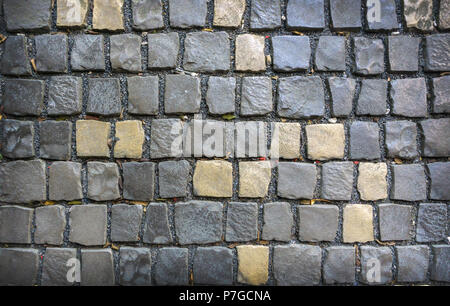 Des pavés gris et jaune. Milieux et de textures. Banque D'Images