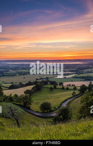 Vue Portrait de coucher du soleil à partir de Coaley Peak, Gloucestershire Banque D'Images