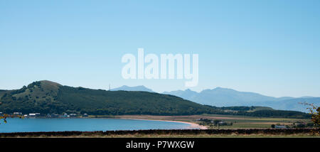 Kilchattan Bay en bute avec les collines d'Arran en arrière-plan Banque D'Images