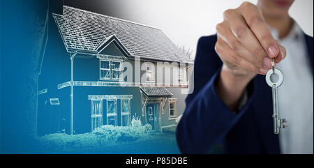 Image composite de mid section of businesswoman showing house key Banque D'Images