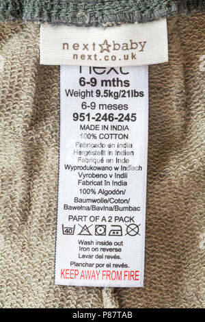 Étiquette en suivant l'habillement de bébé made in India 100 % coton - tenir à l'écart du feu Banque D'Images