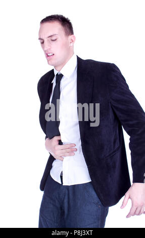 Businessman en costume et cravate, tenant son estomac symbolisant qu'il souffre de diarrhée, isolé sur un fond blanc. Banque D'Images