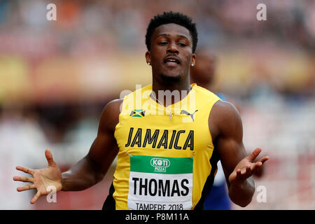 Tampere. 12 juillet, 2018. Damion Thomas de la Jamaïque est en concurrence au cours de la 110 mètres haies (99.0cm) au final l'IAAF (Association Internationale des Fédérations d'athlétisme Championnats du Monde U20) à Tampere en Finlande le 12 juillet 2018. Thomas a remporté la médaille d'or avec 13,16 secondes. Credit : Matti Matikainen/Xinhua/Alamy Live News Banque D'Images