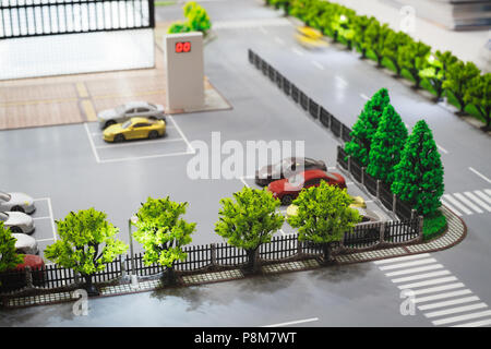 Place de parking sur le modèle de ville rue Banque D'Images