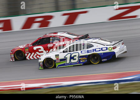 14 juillet 2018 - Sparte, Kentucky, États-Unis d'Amérique - Ty Dillon (13) apporte sa voiture de course à l'avant et pendant l'État Quaker 400 au Kentucky Speedway à Sparte, Kentucky. (Crédit Image : © Chris Owens Asp Inc/ASP via Zuma sur le fil) Banque D'Images