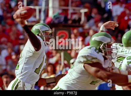 Philadelphia Eagles quarterback Randall Cunningham eludes Dallas Cowboys'  Mike Hegman as he runs 14-yards for a third quarter touchdown at  Philadelphia's Veterans Stadium on Oct. 19, 1986. The Cowboys went on to