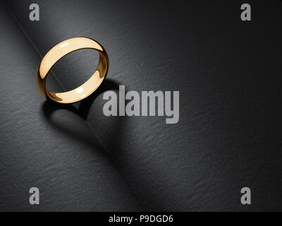 Anneau d'or mariage en forme de coeur casting ombre sur un livre noir. Le rendu 3d illustration Banque D'Images