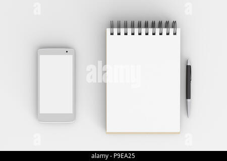 Smartphone à écran blanc et bloc-notes avec stylo isolé sur fond blanc avec chemin de détourage Banque D'Images