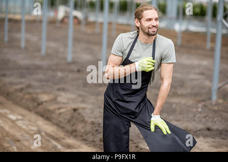 Agriculteur dans la serre Banque D'Images