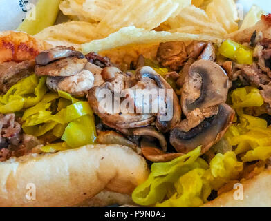 Mushrroms et poivrons sur Steak de fromage Banque D'Images