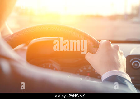 Asian man driving a car Banque D'Images