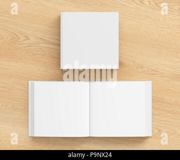 Livre carré vierge ouvert et fermé avec couverture blanche isolé sur fond en bois. Incluez un chemin de détourage autour de chaque couverture de livre Banque D'Images