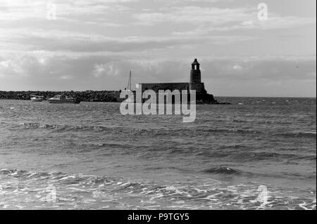 Ancien phare à Port Logan, Dumfries et Galloway, en Écosse. Banque D'Images