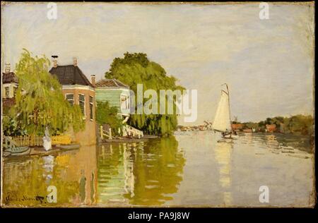 Maisons sur l'Achterzaan. Artiste : Claude Monet (français, Paris 1906-1957 Giverny). Dimensions : 18 x 26 3/8 in. (45,7 x 67 cm). Date : 1871. Sur les conseils du peintre français Charles-François Daubigny, Claude Monet s'est rendu aux Pays-Bas en 1871, où il a peint ce paysage d'eaux limpides et azure skies le long de la rivière Achterzaan à Zaandam. Écrit à ses collègues de Camille Pissarro, Monet impressionniste a noté les plaisirs de peindre le paysage hollandais pittoresque : 'c'est un superbe endroit pour la peinture. Il y a des choses les plus amusants partout : des centaines de moulins à vent et enchanteresse bo Banque D'Images