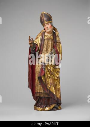 L'évêque avec un livre. Culture : l'allemand. Dimensions : 44 × 15 × 1/2 3/4 8 1/4 in., 19,5 lb. (113 × 40 × 21 cm, 8,9 kg). Date : fin 15ème-début du 16e siècle. Identifié par sa mitre épiscopale, l'évêque les gestes en bénédiction. Cette sculpture, avec la statue de Saint Martin de Tours, située de l'autre côté de la porte, est peut-être venu d'un grand retable sculpté. Musée : Metropolitan Museum of Art, New York, USA. Banque D'Images
