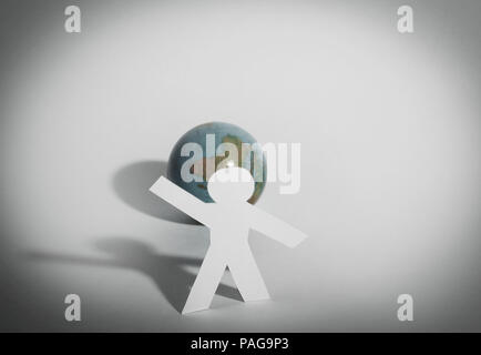 Papier élégant homme debout près de la planète Banque D'Images