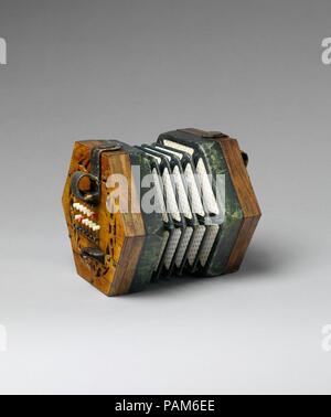 Concertina. Culture : British. Dimensions : 15,9 cm sur W. se termine (6 1/4 in.) point à point : 18,3 cm (7 1/4 in.) D. (fermé) 10,8 cm (4 in.). Bouilloire : Charles Wheatstone (1802-1875). Date : ca. 1862. Un étudiant modèle avec boutons de couleur pour faciliter l'orientation des doigts : les boutons blancs sont pour des tons diatoniques, C'est rouge, les boutons noirs sont les altérations. Musée : Metropolitan Museum of Art, New York, USA. Banque D'Images