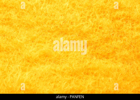 Fourrure artificielle jaune texture background Banque D'Images