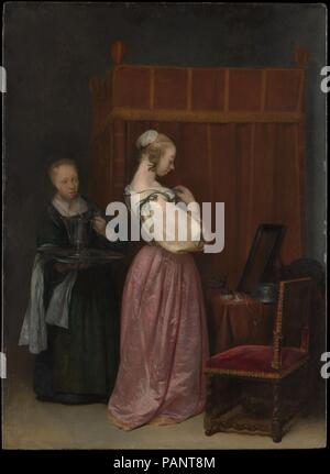 Une jeune femme à sa toilette avec une femme de chambre. Artiste : Gerard Ter Borch le jeune (Néerlandais, Zwolle Deventer 1617-1681). Dimensions : 18 3/4 x 13 5/8 in. (47,6 x 34,6 cm). Date : ca. 1650-51. Ce petit panneau est le plus ancien connu photo par Ter Borch de fixer des chiffres dans un intérieur domestique. Sa sœur Gesina a servi de modèle pour la jeune fille de la maison, dont l'auto-absorption contraste avec la vivacité de la femme de chambre. Musée : Metropolitan Museum of Art, New York, USA. Banque D'Images