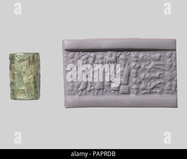 Joint de culasse et d'impression moderne : déesse à la tête d'un adorateur d'une divinité ; dieu taureau assis. Culture : Ancienne colonie commerciale assyrienne. Dimensions : 0.87 in. (2,21 cm). Date : ca. 20ème au 19ème siècle avant J.-C.. Bien que les pierres gravées ont été utilisés dès le 7e millénaire avant J.-C. de cachets dans l'argile, l'invention dans le quatrième millénaire avant J.-C. des cylindres sculptés qui pourraient être reconduits l'argile a permis le développement des conceptions plus complexes seal. Ces sceaux-cylindres, utilisé pour la première fois en Mésopotamie, a servi comme une marque d'appartenance ou d'identification. Les phoques ont été soit impressionné sur des morceaux de l'argile Banque D'Images