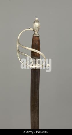 Sabre d'officier de cavalerie. Culture : Cuisine Américaine, Philadelphie. Dimensions : H. 41 in. (104,1 cm) ; H. de blade 34 1/2 in. (87,6 cm) ; W. 4 5/8 po. (11,7 cm) ; D. 4. (10,2 cm) ; WT. 1 lb. 10.3 oz. (745,6 g). Orfèvre : Revêtement par Parry & Musgrave (Américain, Philadelphie Philadelphie 1792-1796). Date : ca. 1793-95. Ce Sabre est exceptionnelle chez dix-huitième-siècle American silver-hilted exemples pour le fait qu'il est construit avec un panier-couilles. La conception de la poignée est susceptible d'avoir été dérivé de l'knuckleguard britannique en prototypes avec défilé des encadrés est liée à la conception jusqu'à la Banque D'Images