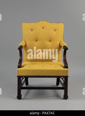 Fauteuil. Culture : L'Américain. Dimensions : 40 x 27 3/8 x 25 5/8 in. (101,6 x 69,5 x 65,1 cm). Bouilloire : attribué à Thomas Affleck (1740-1795). Date : ca. 1766. Ce fauteuil est une version plus sculptés d'un autre exemple (59,154) dans la collection. Les deux ont été faites par Thomas Affleck pour la famille de John Penn. Ici, la méthode 'Marlborough' jambes sont orné d'arches gothiques sur un treillis de Chinois, et l'appuie-bras sont sculptés en leafage. Musée : Metropolitan Museum of Art, New York, USA. Banque D'Images