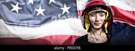 Image composite de female architect wearing helmet against white background Banque D'Images