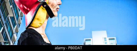 Image composite de female architect wearing helmet against white background Banque D'Images