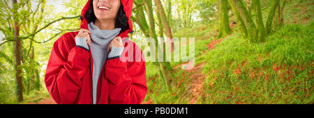 Image composite de femme en veste standing against white background Banque D'Images