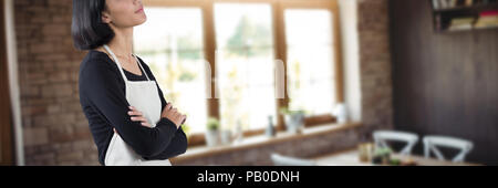 Image composite de pensive waitress standing with arms crossed Banque D'Images