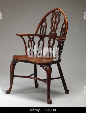 Fauteuil Windsor gothique (l'un d'une paire). Culture : British, vallée de la Tamise. Dimensions : hors tout (confirmé) : 41 × 23 × 22 3/4 in. (106 × 58,4 × 55,9 cm ; hauteur du siège : 18 1/4 in. (46,4 cm) ; Largeur du siège : 22 in. (55,9 cm). Date : ca. Années 1760. Meubles pays typiquement anglais, cette paire de fauteuils Windsor (voir également 2016.250) est une variante de l'arrière-arc plus traditionnelles de conception. Avec son retour en forme d'ogive et mouchetures ajouré afficher remplages Gothique, ces chaises magnifiquement reflètent le goût gothique qui est devenue à la mode en Angleterre au milieu du 18e siècle. Museum Banque D'Images