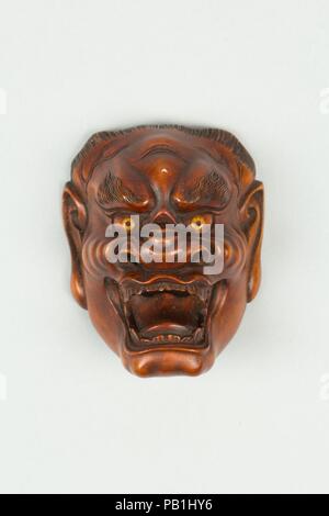 Netsuke de masque. Culture : le Japon. Dimensions : H. 1 7/8 in. (4,8 cm) ; W. 1 5/8 in. (4,1 cm). Date : du 19e siècle. Musée : Metropolitan Museum of Art, New York, USA. Banque D'Images
