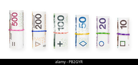 Roulées avec un caoutchouc Polish zloty billets isolé sur fond blanc avec clipping path Banque D'Images