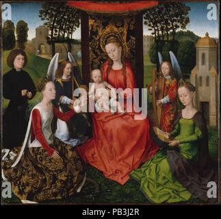 Vierge et enfant avec les saints Catherine d'Alexandrie et Barbara. Artiste : Hans Memling (, Russisch, Seligenstadt par Actif 1465 - 1494 Bruges). Dimensions : Hors tout 26 7/8 x 28 7/8 in. (68,3 x 73,3 cm) ; surface peinte 26 3/8 x 28 3/8 in. (67 x 72,1 cm). Date : début 1480. La photo's composition harmonieuse a été adaptée d'un grand retable, célébré en 1479 Hans Memling terminé pour l'Sint-Janshospitaal à Bruges. Cette petite version plus modeste a été commandé par un donateur anonyme qui s'agenouille sur le côté gauche. Il est indiqué en récitant le chapelet qu'il contemple Saint Catherine's Banque D'Images