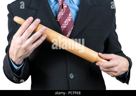 Businessman avec un rouleau à pâte dans les mains Banque D'Images