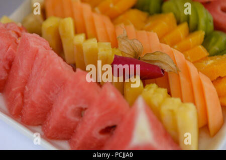 Tranches de pastèque fruits colorés en face de gros plan l'arrière-plan Banque D'Images