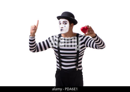 Holding Mime cœur rouge isolé sur fond blanc Banque D'Images