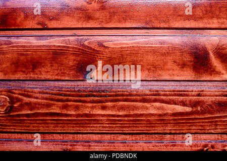 La texture marron acajou chêne huilé prêt à recevoir la décoration.Bourgogne rouge orange en bois revêtus de planches en bois poli.fond, surface conseils verni Banque D'Images